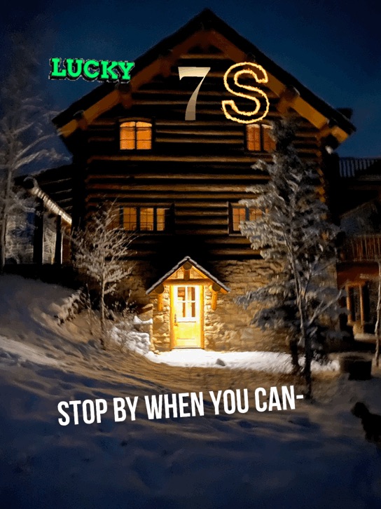 Lucky 7s Lodge at night in fresh snow